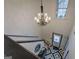 Foyer featuring staircase and patterned tile flooring and chandelier at 2587 Alvecot Cir, Atlanta, GA 30339