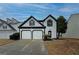 Charming home with a two-car garage and well-manicured lawn, offering great curb appeal at 2587 Alvecot Cir, Atlanta, GA 30339