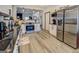 Modern kitchen featuring stainless steel appliances, white cabinetry, and wood-look flooring at 2587 Alvecot Cir, Atlanta, GA 30339