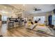 Open-concept living and dining space with barstool seating and modern decor at 2587 Alvecot Cir, Atlanta, GA 30339