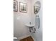 Charming powder room with stylish tilework, a decorative mirror, and modern fixtures at 1661 La France Street Ne Unit #216, Atlanta, GA 30307