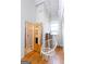 Relaxing bedroom featuring hardwood floors and unique hanging chair near bathroom at 1661 La France Street Ne Unit #216, Atlanta, GA 30307