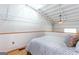 Upstairs bedroom with modern gray bedding and bright natural light at 1661 La France Street Ne Unit #216, Atlanta, GA 30307