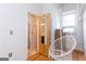 Relaxing bedroom featuring hardwood floors and unique hanging chair near bathroom at 1661 La France Street Ne Unit #216, Atlanta, GA 30307