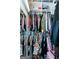 Close-up of a well-organized closet featuring clothing, accessories, and storage shelves at 1661 La France Street Ne Unit #216, Atlanta, GA 30307
