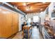 Modern kitchen that flows into the living room featuring wooden beams and stainless steel appliances at 1661 La France Street Ne Unit #216, Atlanta, GA 30307