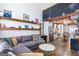 Inviting living area with comfortable seating, open kitchen, and a view of the home's stylish interior layout at 1661 La France Street Ne Unit #216, Atlanta, GA 30307
