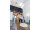 Spacious living room featuring high ceilings, eclectic decor, and seamless flow into other areas of the home at 1661 La France Street Ne Unit #216, Atlanta, GA 30307