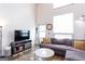 Bright living room featuring a comfortable sofa and modern decor, offering a cozy and inviting atmosphere at 1661 La France Street Ne Unit #216, Atlanta, GA 30307