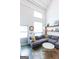 Spacious living room with a large window, showcasing natural light and modern decor, creating an inviting space at 1661 La France Street Ne Unit #216, Atlanta, GA 30307