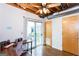 Bright bonus room with ceiling fan, desk and access to a cozy outdoor patio at 1661 La France Street Ne Unit #216, Atlanta, GA 30307