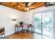 Bright bonus room with ceiling fan, desk and access to a cozy outdoor patio at 1661 La France Street Ne Unit #216, Atlanta, GA 30307