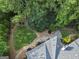 Beautifully landscaped backyard featuring a well-maintained lawn, stone pathways, and mature trees offering privacy at 107 Calloway Xing, Peachtree City, GA 30269