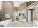 Spacious bathroom featuring a soaking tub, dual vanity sinks, with travertine-like flooring at 107 Calloway Xing, Peachtree City, GA 30269