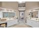 Spacious bathroom featuring dual vanity sinks, walk-in shower, and travertine-like tile flooring at 107 Calloway Xing, Peachtree City, GA 30269