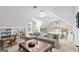 Bright, carpeted bedroom featuring a seating area, built in shelving and an abundance of natural light at 107 Calloway Xing, Peachtree City, GA 30269