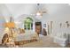 Bright bedroom with a large window, ceiling fan, neutral carpet, and a bed with gold and white bedding at 107 Calloway Xing, Peachtree City, GA 30269