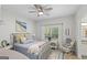 Bedroom boasts natural light from the window, a ceiling fan, and stylish decor, creating a tranquil retreat at 107 Calloway Xing, Peachtree City, GA 30269