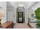 Inviting foyer with hardwood floors, arched transom, and neutral decor at 107 Calloway Xing, Peachtree City, GA 30269