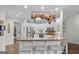 Modern kitchen features white cabinetry, granite countertops, and stainless steel appliances at 107 Calloway Xing, Peachtree City, GA 30269