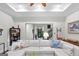 Comfortable living room features a plush white sectional, a stylish rug, and access to the front entry at 107 Calloway Xing, Peachtree City, GA 30269