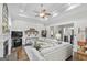 Spacious living room with tray ceiling, fireplace, and comfortable white sofa, perfect for relaxing and entertaining at 107 Calloway Xing, Peachtree City, GA 30269