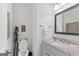 Cozy powder room featuring a unique vanity with granite countertops at 107 Calloway Xing, Peachtree City, GA 30269