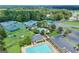 Aerial view features tennis courts and a sparkling pool, highlighting recreational amenities in the community at 269 Legends Trce, Mcdonough, GA 30253