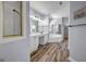 Bathroom featuring dual vanity, soaking tub, walk-in shower, and modern fixtures at 269 Legends Trce, Mcdonough, GA 30253