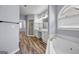 Bathroom with dual vanity, soaking tub, walk-in shower, and modern fixtures at 269 Legends Trce, Mcdonough, GA 30253