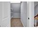 Walk-in closet features wire shelving and neutral carpeting at 269 Legends Trce, Mcdonough, GA 30253