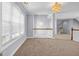 Bright hallway features chandelier lighting, white trim and large windows at 269 Legends Trce, Mcdonough, GA 30253