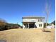 Exterior shot of the home with a spacious backyard and covered patio at 5257 Shorthorn Way, Powder Springs, GA 30127