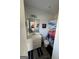 Bathroom with white vanity, toilet, football-themed shower curtain, and dark floor mat at 5257 Shorthorn Way, Powder Springs, GA 30127