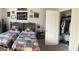 Bedroom showcasing twin beds with sports decor and closet with clothes at 5257 Shorthorn Way, Powder Springs, GA 30127