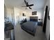Spacious bedroom features a king-sized bed and work area, enhanced by natural light at 5257 Shorthorn Way, Powder Springs, GA 30127