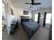 Stylish bedroom with king-sized bed, a work area, and a view of the bathroom at 5257 Shorthorn Way, Powder Springs, GA 30127