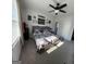 This bedroom features twin beds, a ceiling fan, and sports themed décor at 5257 Shorthorn Way, Powder Springs, GA 30127
