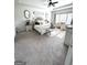 Elegant bedroom with natural light, a ceiling fan, and a cozy sitting area at 5257 Shorthorn Way, Powder Springs, GA 30127