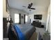 Spacious bedroom with a ceiling fan, TV, and large windows for natural light at 5257 Shorthorn Way, Powder Springs, GA 30127