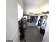 Walk-in closet with organized storage racks and shelves for clothes and shoes at 5257 Shorthorn Way, Powder Springs, GA 30127