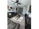 Upstairs media room featuring large screen tv, ceiling fan, and comfortable seating at 5257 Shorthorn Way, Powder Springs, GA 30127