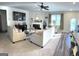 Bright living room features neutral tones, fireplace, ceiling fan and open floor plan at 5257 Shorthorn Way, Powder Springs, GA 30127