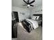 Comfortable bedroom featuring soft carpet, ceiling fan and natural light at 5257 Shorthorn Way, Powder Springs, GA 30127
