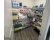 Organized walk-in pantry with wire shelving and ample storage space for groceries and supplies at 5257 Shorthorn Way, Powder Springs, GA 30127
