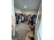 A large walk-in closet providing generous storage for shoes, bags, and clothes at 5257 Shorthorn Way, Powder Springs, GA 30127