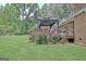Charming backyard with a patio, rose bushes, and a well-maintained lawn at 260 Sharon Dr, Fayetteville, GA 30214