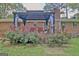 Backyard featuring beautiful roses and a large covered patio space at 260 Sharon Dr, Fayetteville, GA 30214