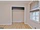 Well-lit bedroom featuring closet with ample storage space and a window at 260 Sharon Dr, Fayetteville, GA 30214