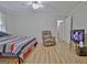Bedroom with wood-look floors, soft natural light, and recliner at 260 Sharon Dr, Fayetteville, GA 30214